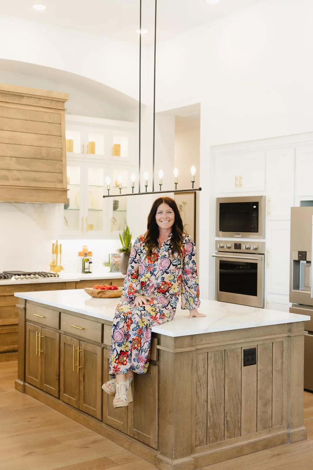 Jenny Marsh seated on a kitchen island